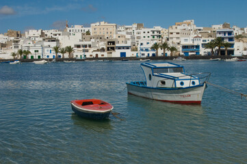 Boats and houses in the San Gines Lagoon. Arrecife. Lanzarote. Canary Islands. Spain.