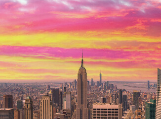 Midtown Manhattan at sunset, New York City. Panoramic aerial view of city skyscrapers at dusk