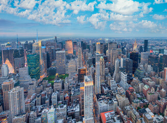 Fototapeta premium Midtown Manhattan at sunset, New York City. Panoramic aerial view of city skyscrapers at dusk