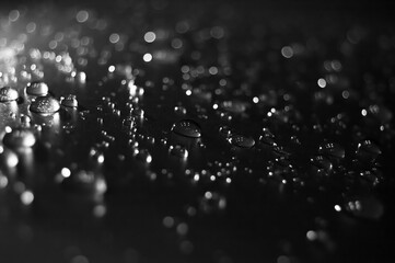 drops of water on the car after rain with bright flash