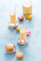 Assorted delicious French macarons with egg liqueur or eggnog