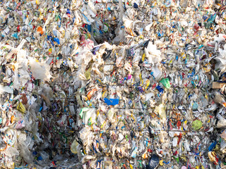 Compressed piles of garbage and plastic waste - pollution from our trash
