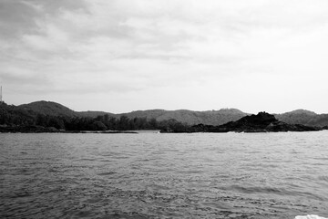 rocky coast of the indian ocean in black and white