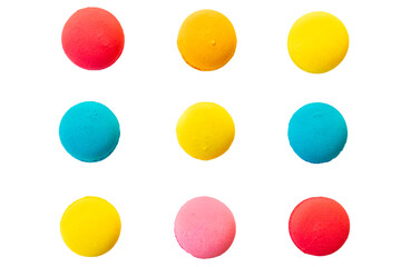 Colored macarons lined up on top of each other, many macarons