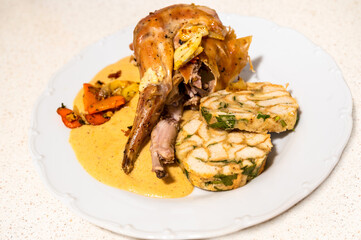 Baked rabbit leg with creamy and spicy vegetable sauce and Carlsbad dumpling.
