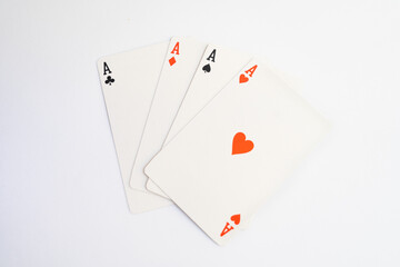 Four playing cards of Aces isolated on white background