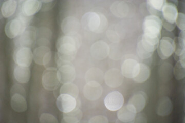 Festive New Year and Christmas bokeh. Beautiful gray lights for design