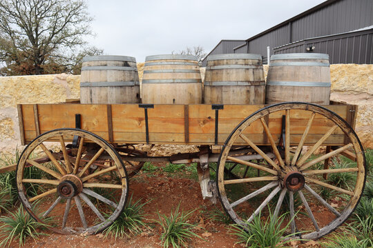 An Old Wood Wagon With Wine Barrels Loaded In A Carriage Nearby Fredericksburg, Texas