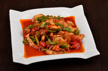 boiled chicken meat with stewed peppers and vegetables in sauce, asian food