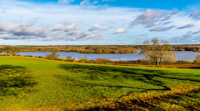 A view across the fields towards Pitsford Reservoir, UK on a sunny day