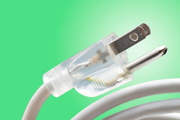 power cord with a clear plug on a green background