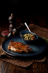 Fancy grill house meal: loin with grill marks and side salad