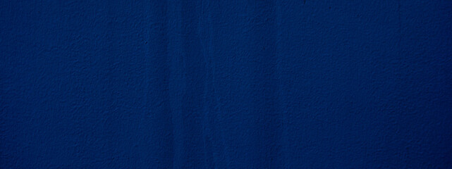 Abstract grunge decor. Beautiful dark blue stucco wall background. Space for designing and inserting text.