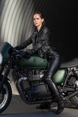 Plakat woman in black with a motorcycle