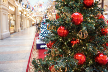 Decorated Christmas tree on blurred, sparkling and fairy background