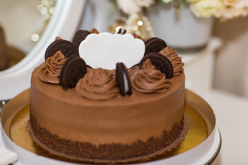 Obraz na płótnie Canvas chocolate cake on a white plate