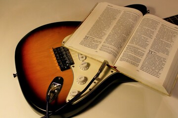 guitar plugged into Holy Bible for true worship