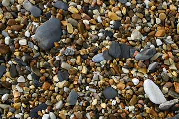 background of stones, network of rocks on a beach