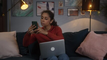 Black woman using phone with AR 3D liar scan sensor, building mixed augmented reality model on table, student using vr technology on distance learning during lockdown, freelancer remote work.