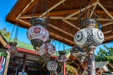 Amazing traditional turkish ceiling glass mosaic lamps hang on shops and streets.