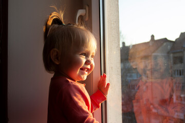 child looking through window