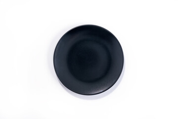 Fototapeta na wymiar Empty Matte Black plate isolated on white background top view