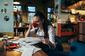 woman entrepreneur dealing with financial in her restaurant