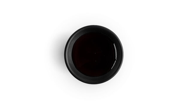 Soy sauce in a saucepan on a white background. High quality photo