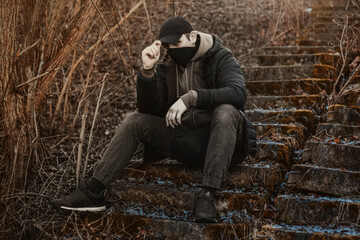 ganster sitting on the ground