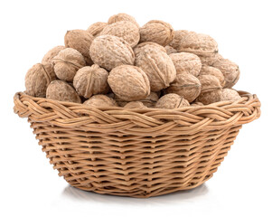 Walnuts in the basket isolated on white background