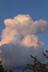 cumulonimbus cloud over clean blue sky in summer