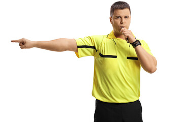 Football referee blowing a whistle and pointing