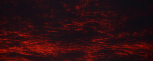 Dark sky with dramatic red clouds background