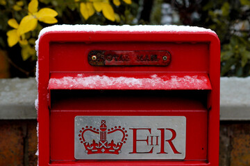 Red British Post Box, capped with snow