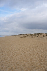Fototapeta na wymiar Sand dunes with nobody and a storm behind in Comporta, Portugal