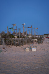 Beach at night with fishing material and fishermen houses in Comporta, Portugal