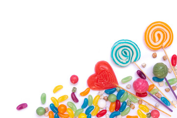 Mixed colorful lollipops and candies on isolated white background