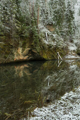 City Cesis, Latvia. Red sand rocks and snow in winter.Travel photo.