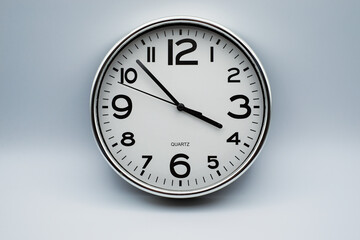 Closeup of retro analog clock on grey background