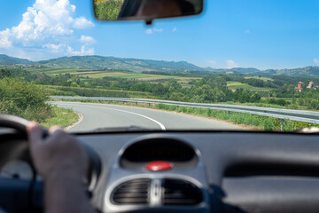 Driving on a road through an idyllic countryside in Serbia
