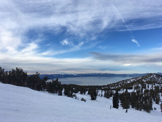 Landscape views of Lake Tahoe from a ski resort, on a cloudy winter day