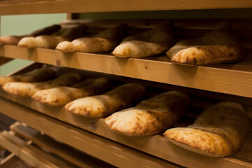 Lavash, Bakery Products fresh pastry sells pita market wheat tortillas close-up Caucasian kitchen Lavash Pita or Arabic bread traditional healthy eastern Georgian flatbreads paper bags country Georgi