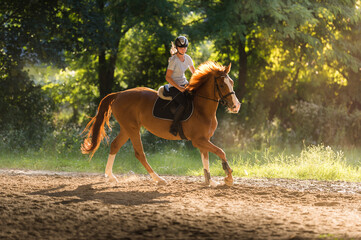 Young  girl riding a horse