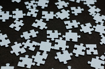 Puzzle pieces on the black background