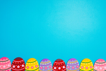 Easter Eggs. Colorful Easter eggs on blue background with copy space
