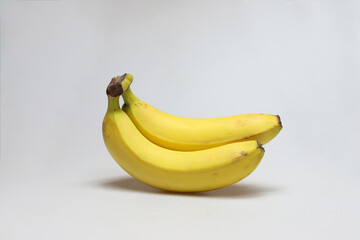 Two banana fruits on a white background