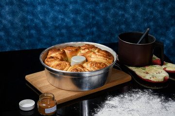 home made artisanal coconut bread on a reflective dark glass background