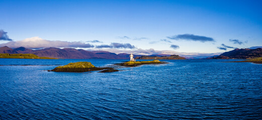 Aerial view of Sager Bhuidhe Lighthouse, loch linnhe and offshore islands on the west coast of the argyll region of the highlands of Scotland during winter