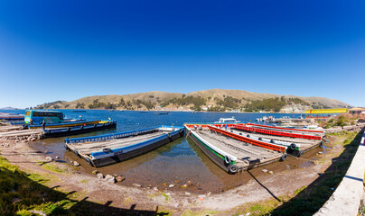 Fototapeta na wymiar San Pedro de Tiquina, Titicaca lake: Lake passage ships transporting cars through the lake towards the islands