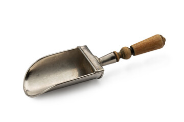a small shovel made of white metal with a wooden handle, antique work. Kitchen tool, isolate on...